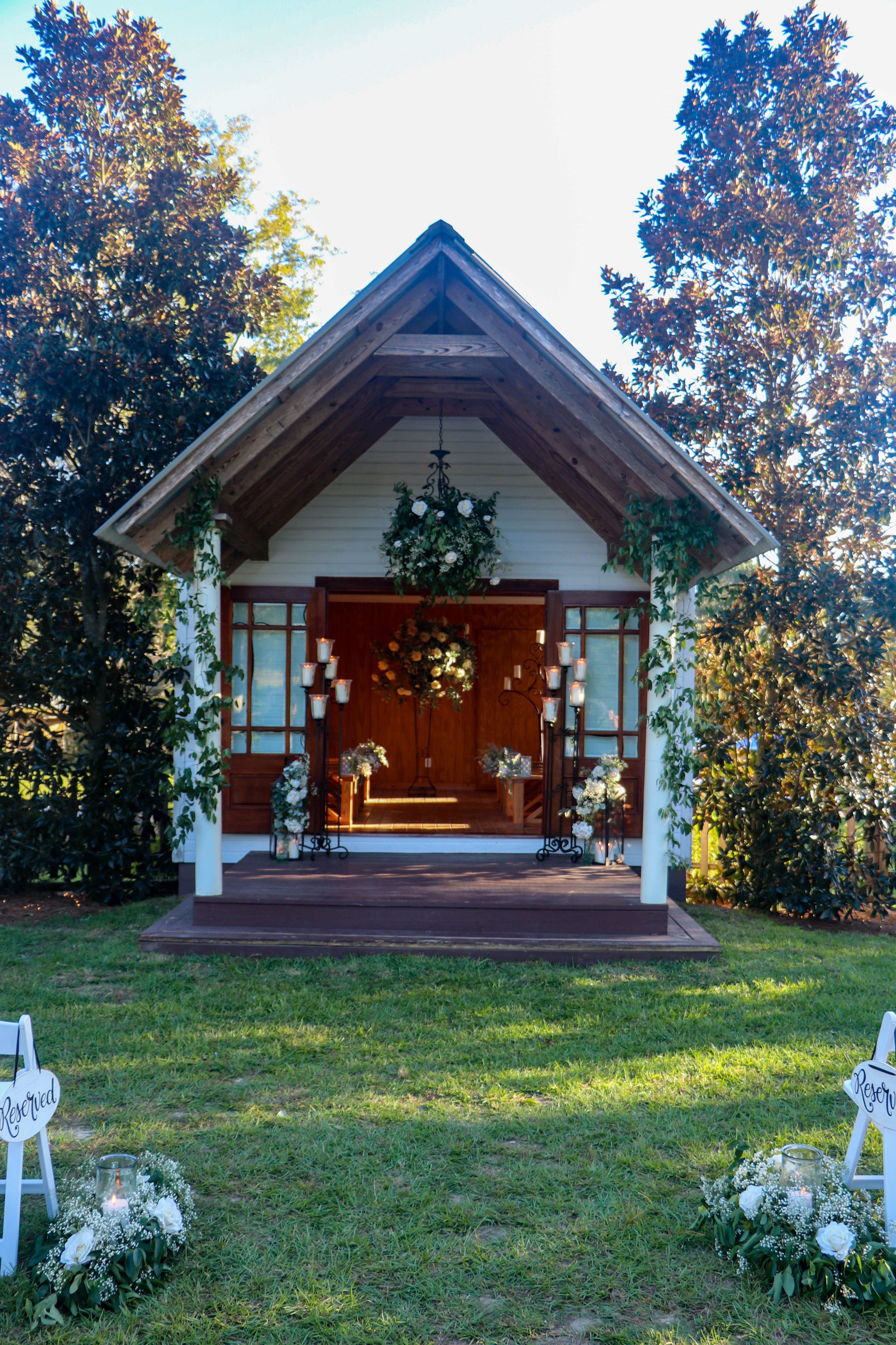 Country chapel entrance surrounded by trees